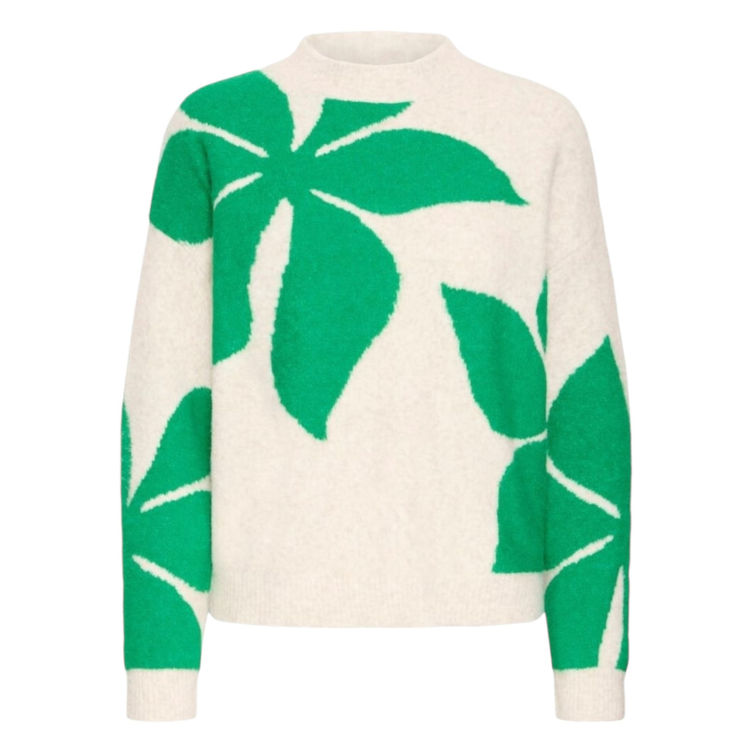 Cream sweater with green leaf patterns on a white background