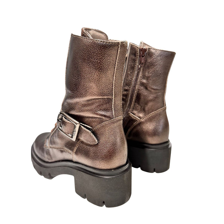 Pair of metallic brown boots with buckles on a white background