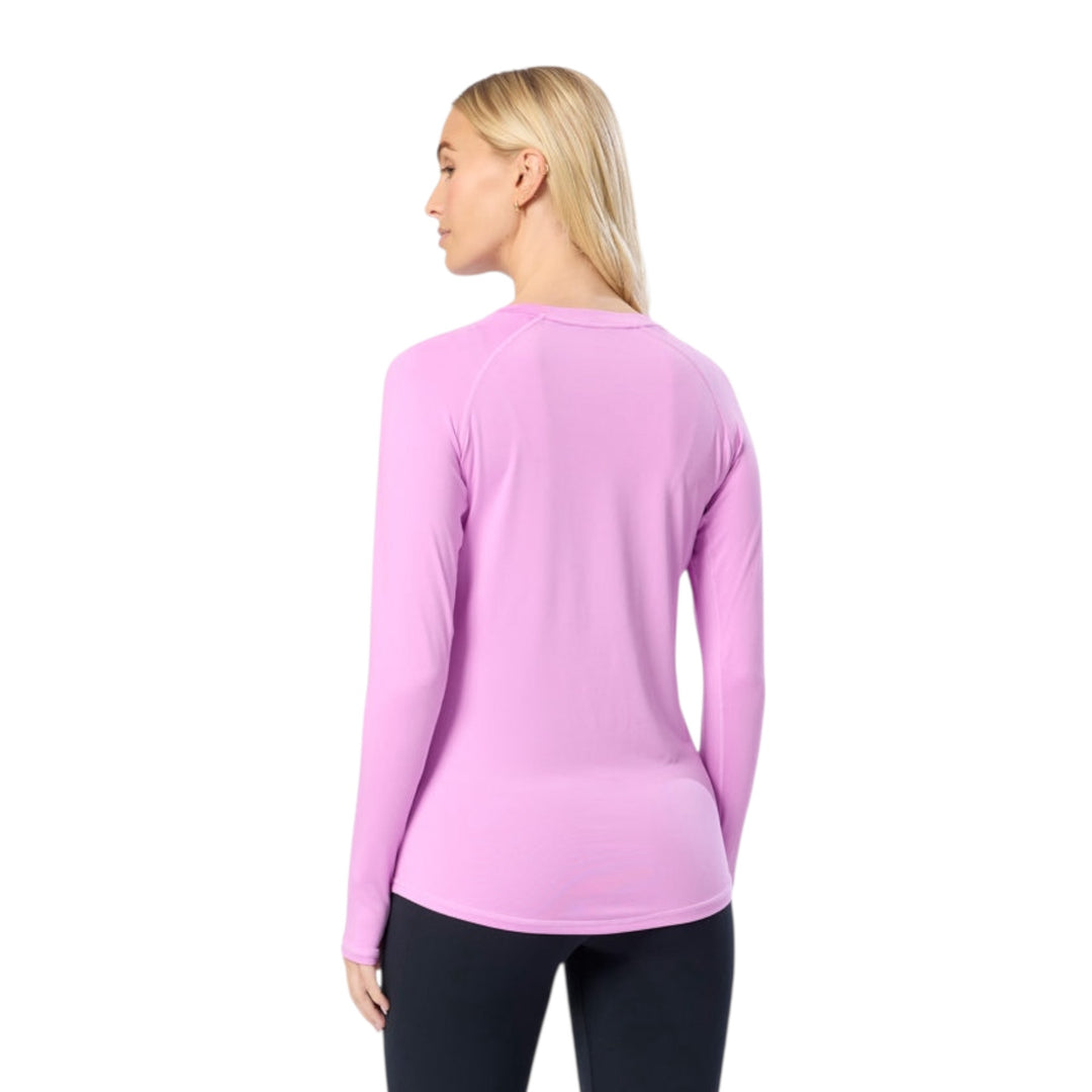 Woman wearing a purple long-sleeve shirt on a white background