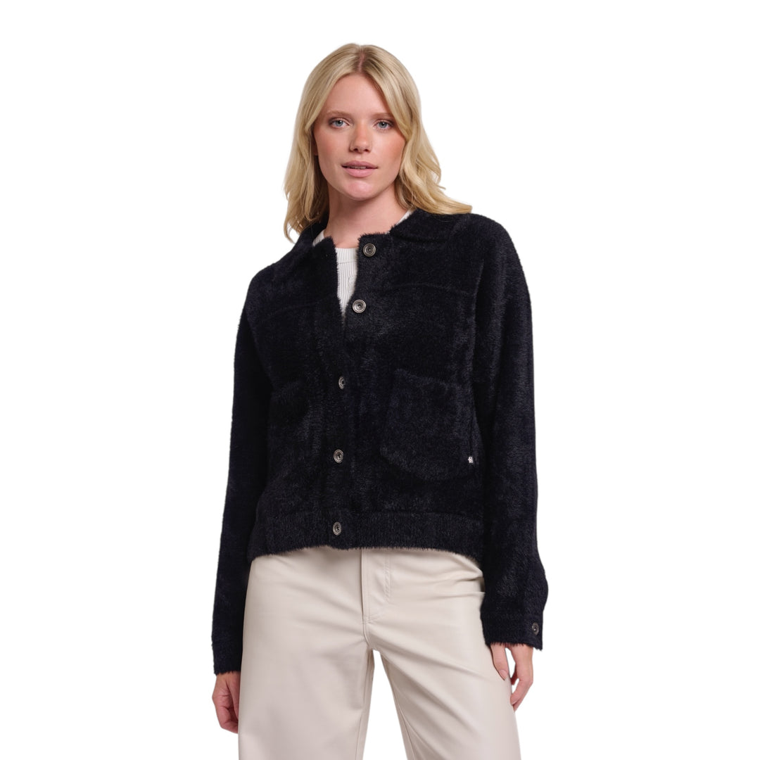 Woman wearing a black jacket on a white background