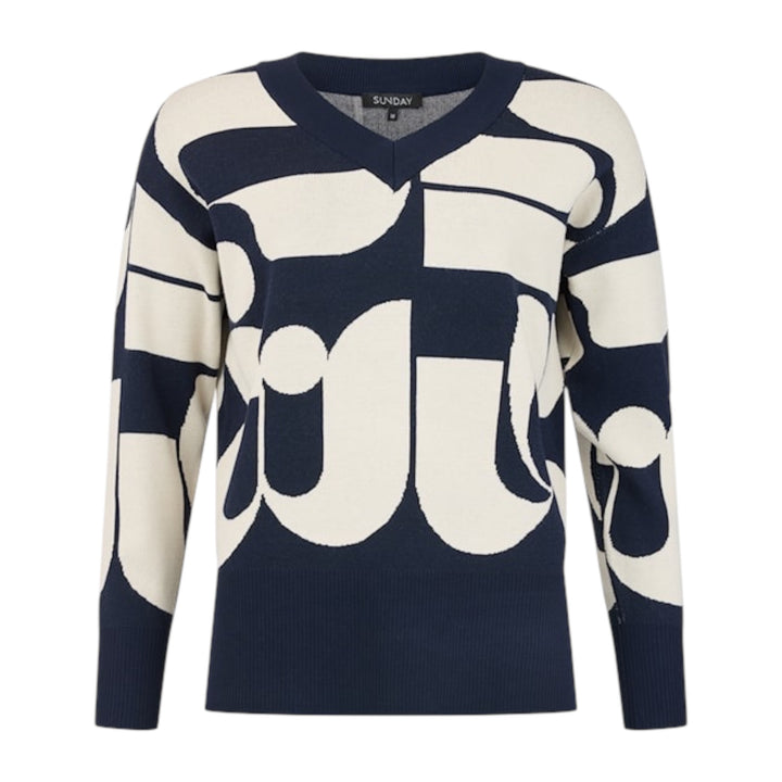 Navy and white patterned sweater on a white background