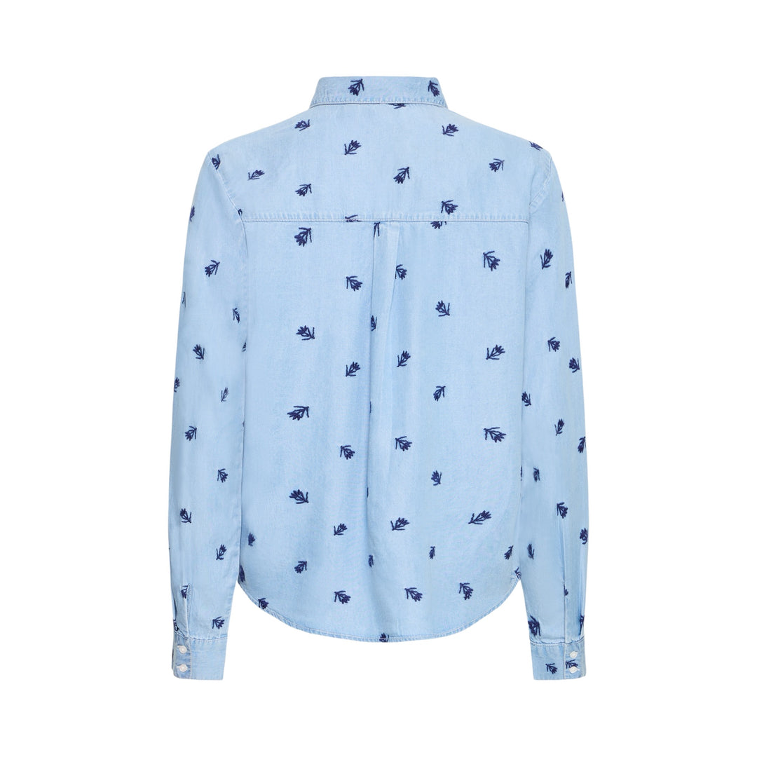 Blue denim shirt with small embroidered flowers on a white background, back view