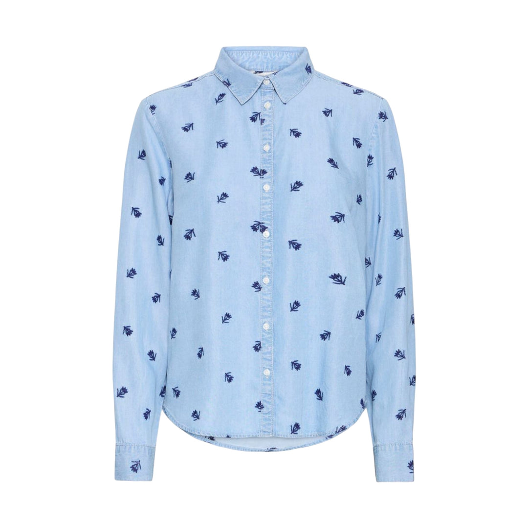 Light blue shirt with small embroidered dark blue flowers on a white background
