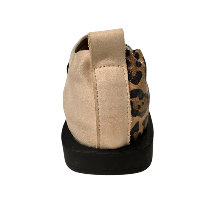 Beige slip-on shoe with leopard print on a white background