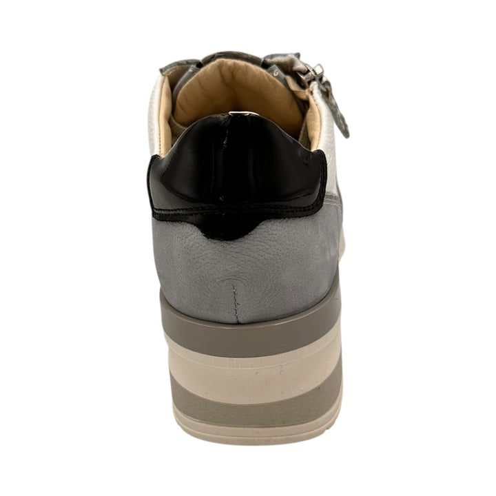 Light blue and white sneaker with black accents on a white background