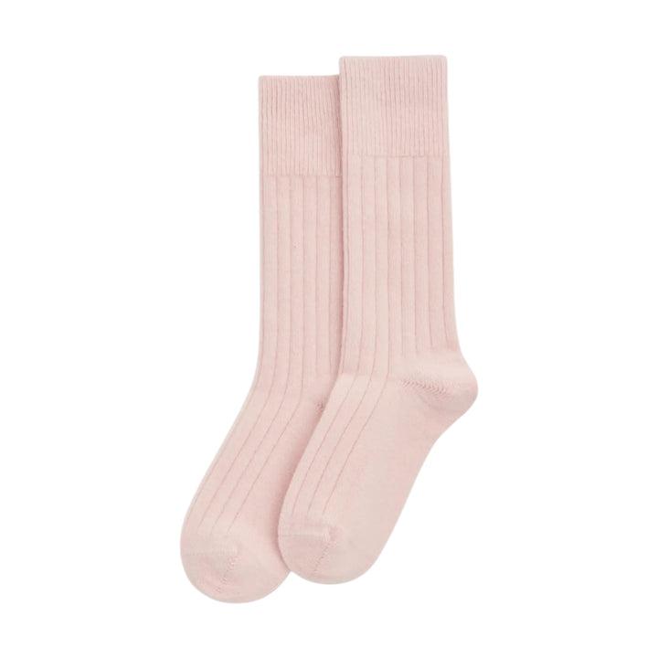 A pair of light pink ribbed bed socks displayed against a solid white background.