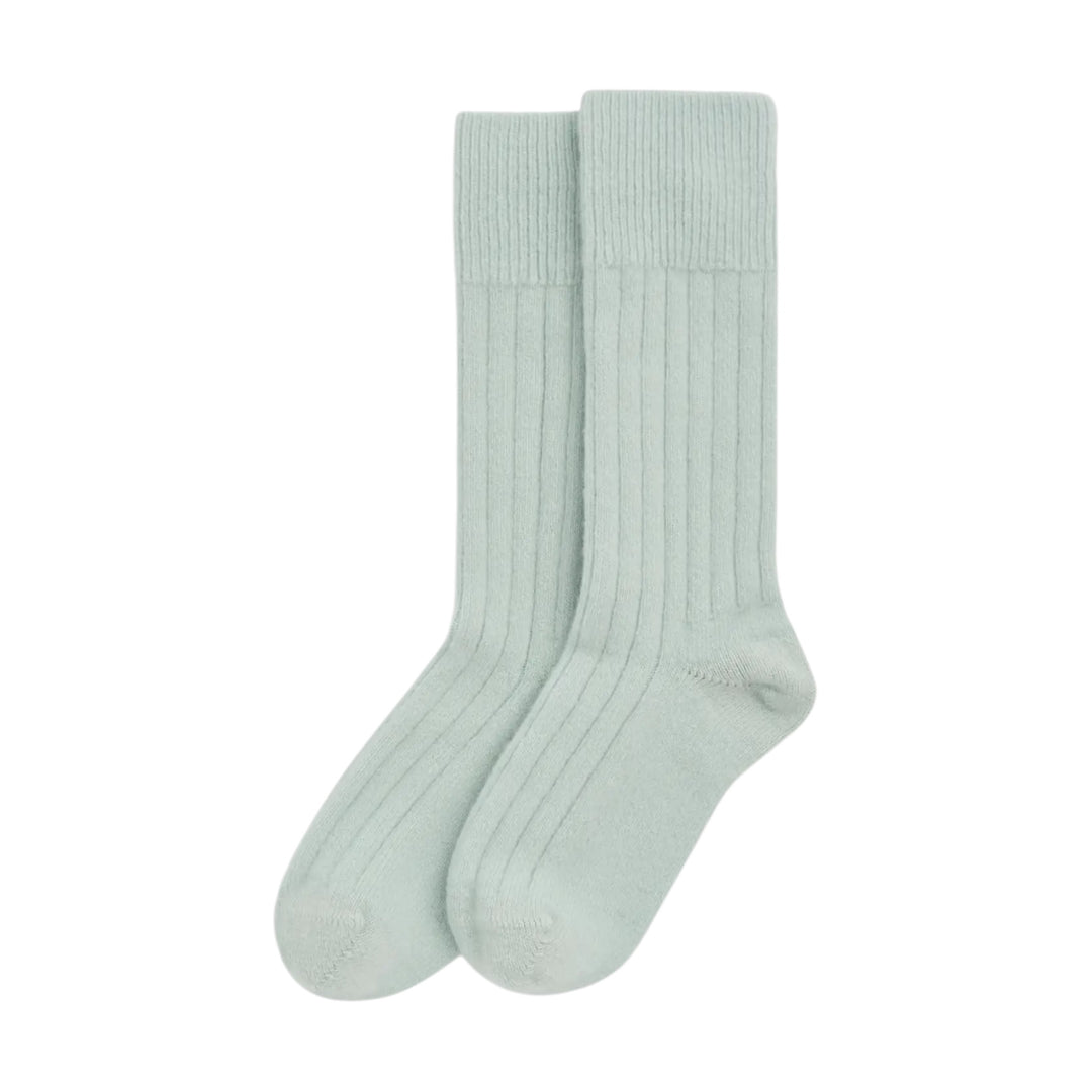 A pair of ribbed bed socks in a pale mint green color, displayed against a solid white background.