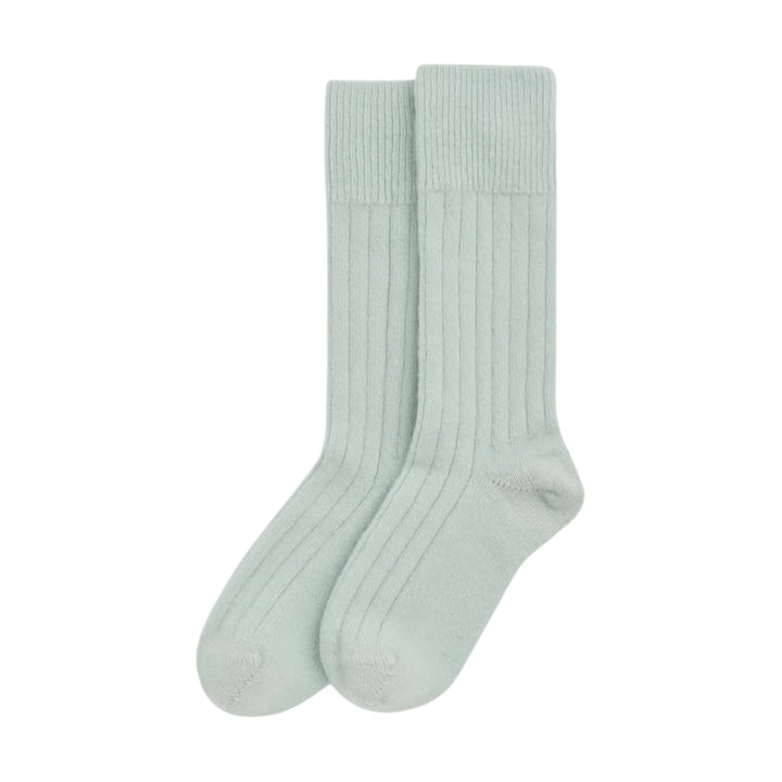 A pair of ribbed bed socks in a pale mint green color, displayed against a solid white background.