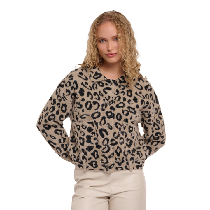 Woman wearing a leopard print sweater on a white background