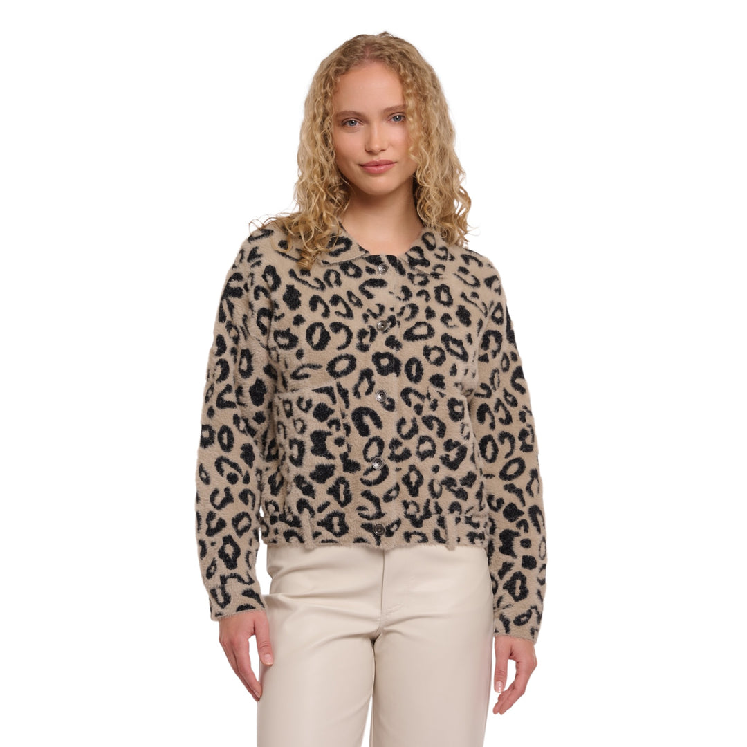 Woman wearing a leopard print sweater on a white background