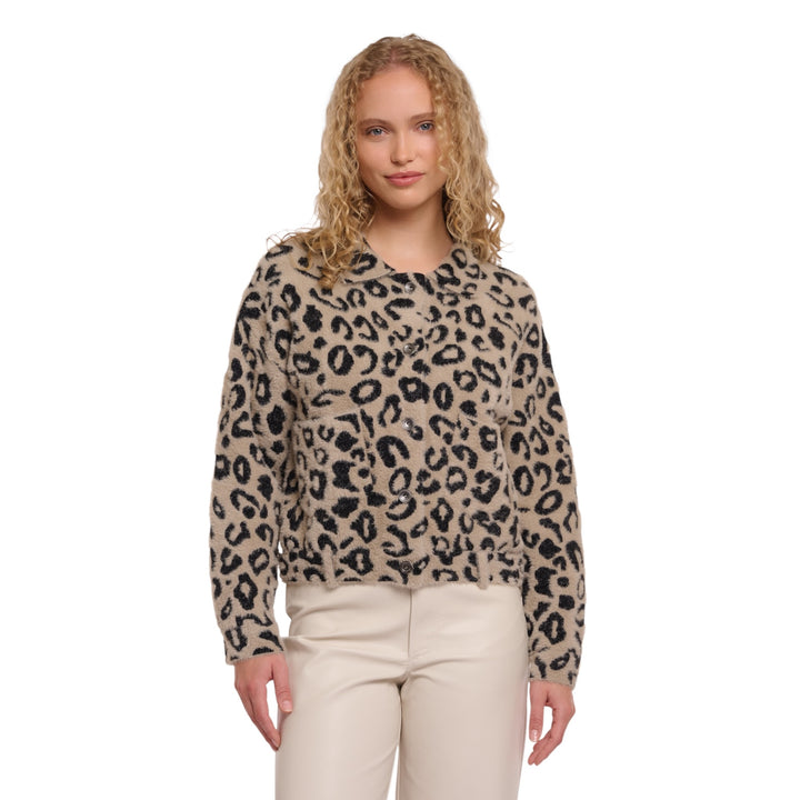 Woman wearing a leopard print sweater on a white background