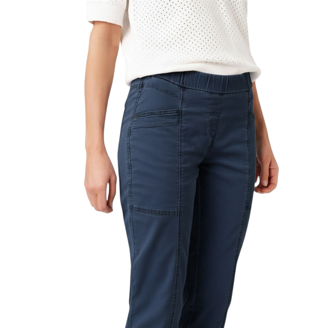 Person wearing blue pants on a white background